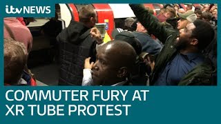 Commuters drag Extinction Rebellion protesters off Tube trains  ITV News [upl. by Laks]